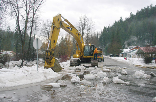 Digging out the ice. Photo by Kootenai Valley Record.