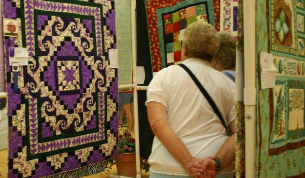 Admiring the quilts. Photo by LibbyMT.com.