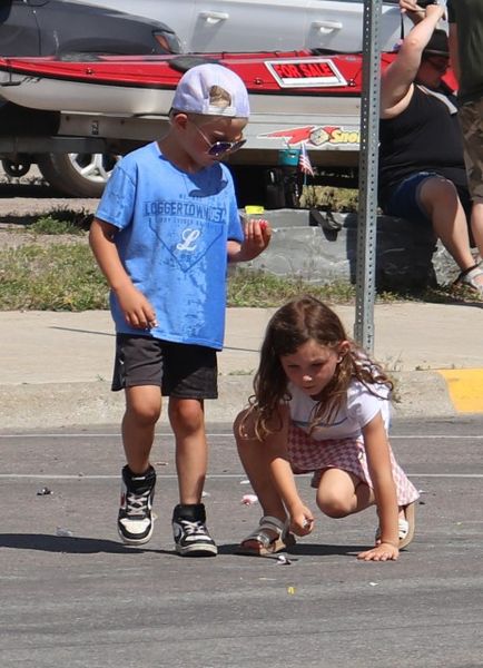 Cleaning up after the parade. Photo by LibbyMT.com.