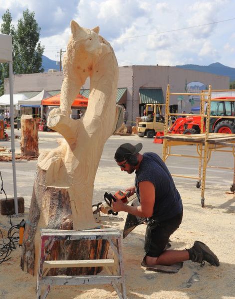Ryan Villiers works on his carving on Friday. Photo by LibbyMT.com.