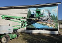 Clear coating the mural. Photo courtesy The Heritage Museum.