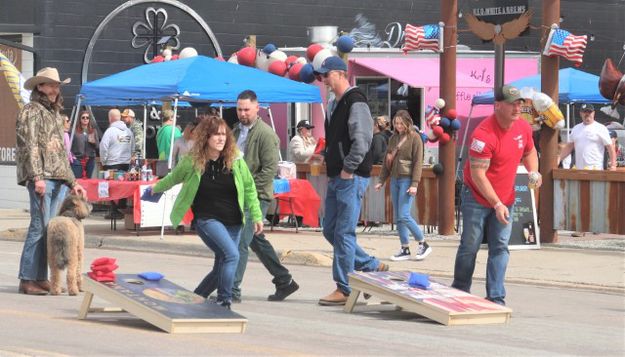 Cornhole practice. Photo by LibbyMT.com.