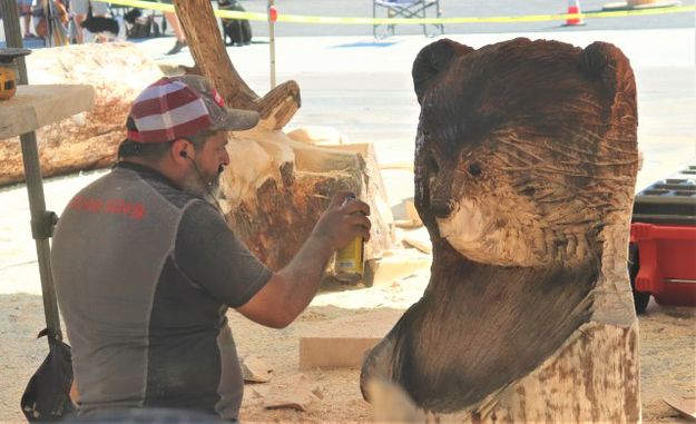 Adrian works on a bear. Photo by LibbyMT.com.